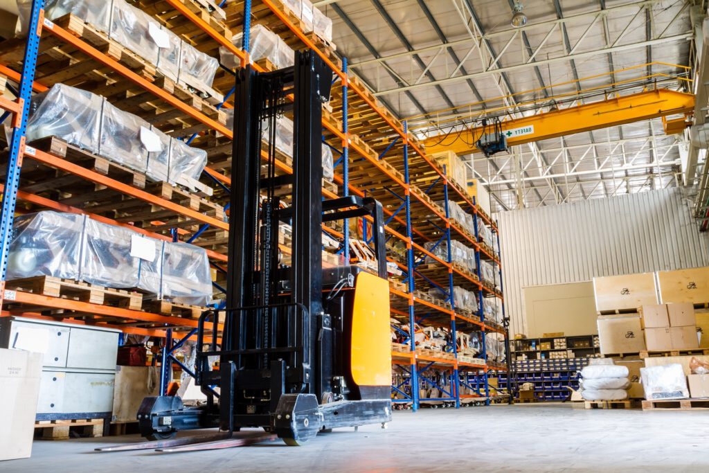 Modern warehouse with forklifts